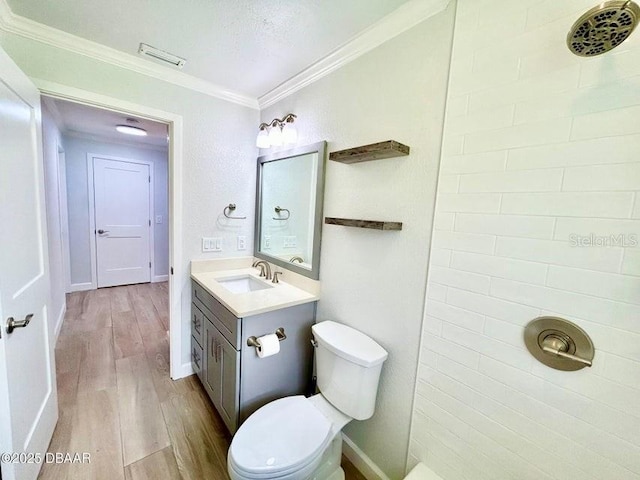 2017 Old Daytona Rd, Port Orange, FL 32128 - bathroom with wood finished floors, vanity, a tile shower, and ornamental molding