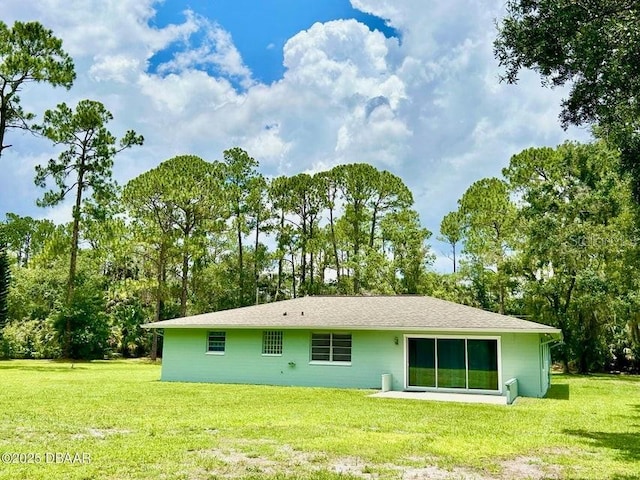 2017 Old Daytona Rd, Port Orange, FL 32128 - rear view of property with a lawn