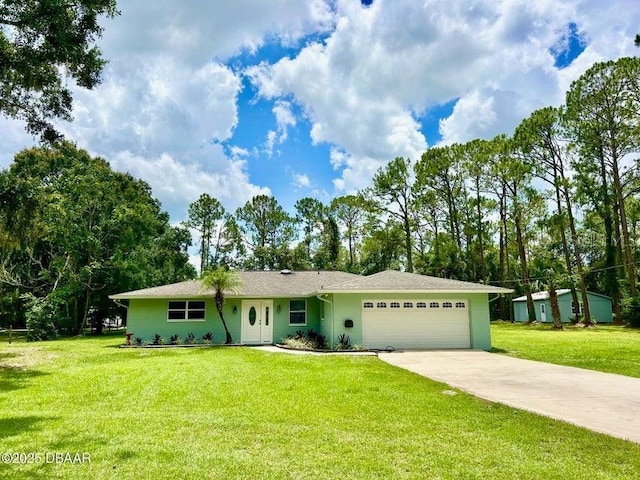 2017 Old Daytona Rd, Port Orange, FL 32128 - ranch-style home featuring a garage, concrete driveway, and a front yard