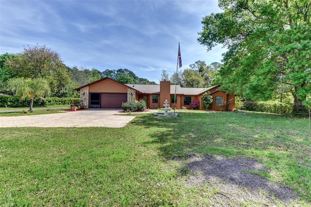 2345 Tomoka Farms Rd, Port Orange, FL 32128 - ranch-style house with concrete driveway, an attached garage, a front yard, and a chimney