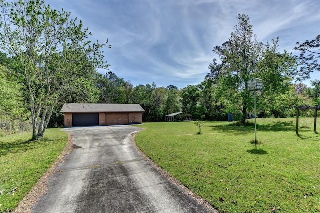 2345 Tomoka Farms Rd, Port Orange, FL 32128 - view of front of property featuring a garage and a front yard