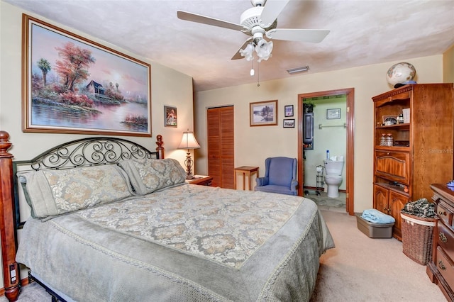 2345 Tomoka Farms Rd, Port Orange, FL 32128 - bedroom featuring light carpet, a closet, ensuite bath, and ceiling fan