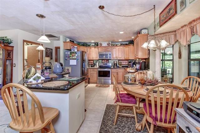 2345 Tomoka Farms Rd, Port Orange, FL 32128 - kitchen featuring stainless steel appliances, a peninsula, light tile patterned flooring, hanging light fixtures, and recessed lighting