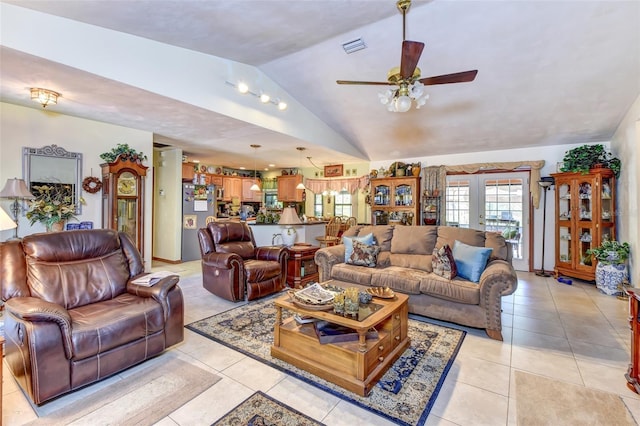 2345 Tomoka Farms Rd, Port Orange, FL 32128 - living room with vaulted ceiling, ceiling fan, light tile patterned flooring, and french doors