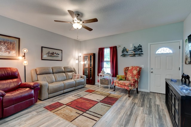 5005 Joseph St, Hastings, FL 32145 - living room featuring wood finished floors, healthy amount of natural light, and a ceiling fan