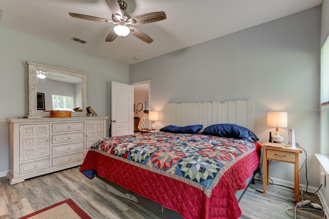 5005 Joseph St, Hastings, FL 32145 - bedroom with light wood finished floors and ceiling fan