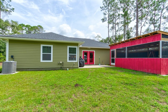 5005 Joseph St, Hastings, FL 32145 - back of house featuring a sunroom, a yard, a patio area, and french doors