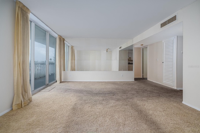 2800 N Atlantic Ave Unit 210, Daytona Beach, FL 32118 - carpeted empty room with baseboards