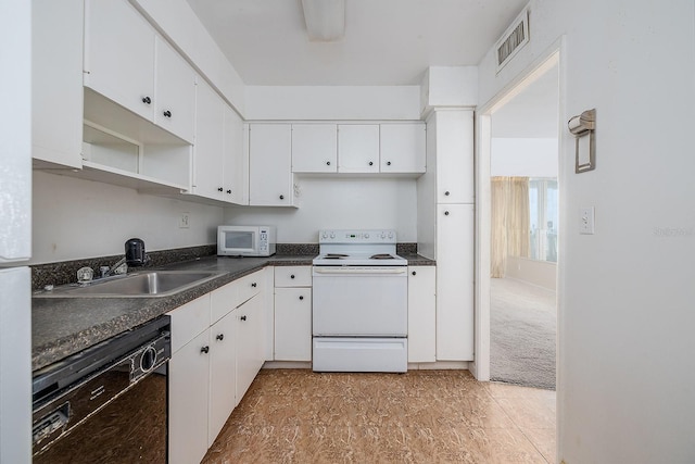 2800 N Atlantic Ave Unit 210, Daytona Beach, FL 32118 - kitchen with white appliances, dark countertops, white cabinetry, and open shelves