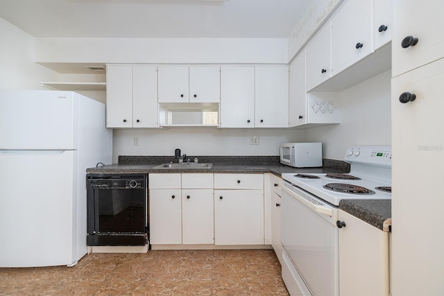 2800 N Atlantic Ave Unit 210, Daytona Beach, FL 32118 - kitchen with white appliances, dark countertops, and white cabinets