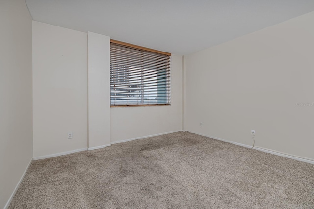 2800 N Atlantic Ave Unit 210, Daytona Beach, FL 32118 - carpeted spare room featuring baseboards