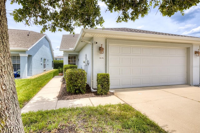 1636 Areca Palm Dr, Port Orange, FL 32128 - view of front of home featuring driveway, a garage, and a shingled roof