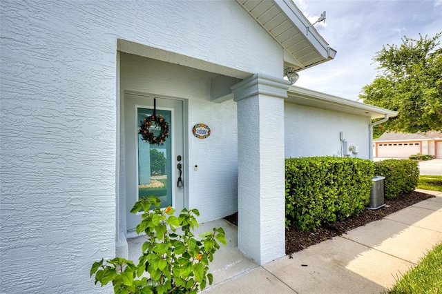 1636 Areca Palm Dr, Port Orange, FL 32128 - view of exterior entry featuring stucco siding