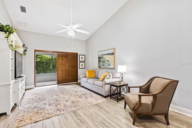 1636 Areca Palm Dr, Port Orange, FL 32128 - living room with high vaulted ceiling, light wood-style floors, and ceiling fan