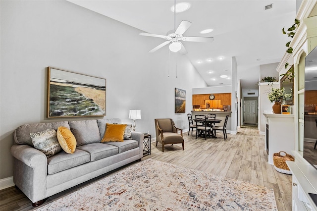 1636 Areca Palm Dr, Port Orange, FL 32128 - living area featuring high vaulted ceiling, light wood-style floors, and ceiling fan