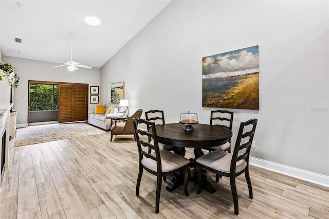 1636 Areca Palm Dr, Port Orange, FL 32128 - dining room featuring light wood-style flooring, high vaulted ceiling, and a ceiling fan