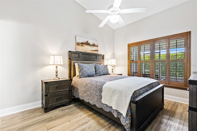 1636 Areca Palm Dr, Port Orange, FL 32128 - bedroom with light wood-style flooring, ceiling fan, and lofted ceiling