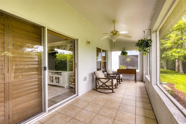 1636 Areca Palm Dr, Port Orange, FL 32128 - sunroom featuring a ceiling fan and vaulted ceiling
