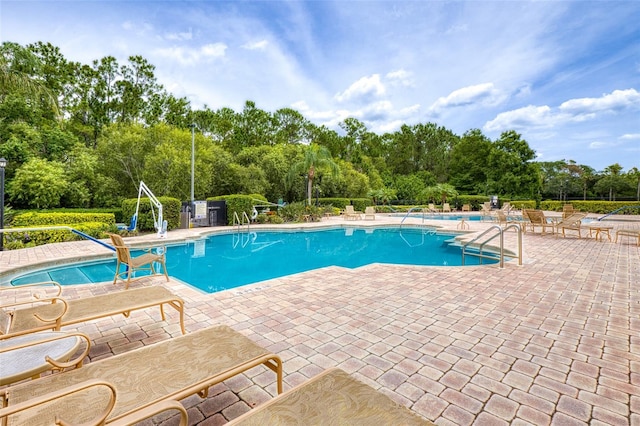 1636 Areca Palm Dr, Port Orange, FL 32128 - community pool featuring a patio and view of scattered trees