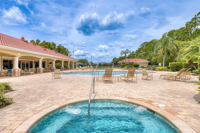 1636 Areca Palm Dr, Port Orange, FL 32128 - community pool featuring a patio and a hot tub