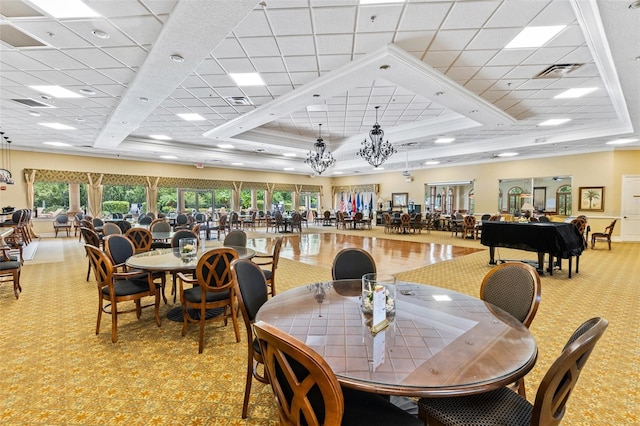 1636 Areca Palm Dr, Port Orange, FL 32128 - dining space featuring a raised ceiling, a drop ceiling, light colored carpet, and crown molding