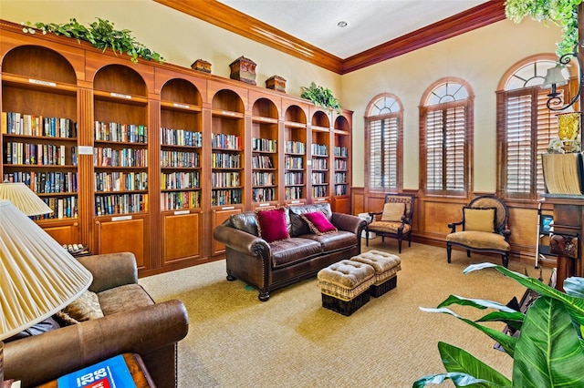 1636 Areca Palm Dr, Port Orange, FL 32128 - sitting room featuring crown molding, carpet flooring, a wainscoted wall, and bookshelves