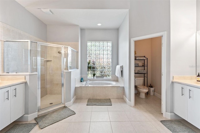 6710 Merryvale Ln, Port Orange, FL 32128 - full bathroom with vanity, a shower stall, a garden tub, and recessed lighting