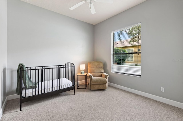 6710 Merryvale Ln, Port Orange, FL 32128 - carpeted bedroom with a crib and ceiling fan