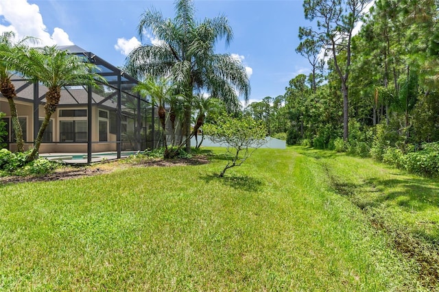 6710 Merryvale Ln, Port Orange, FL 32128 - view of green lawn with glass enclosure