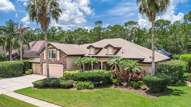 6710 Merryvale Ln, Port Orange, FL 32128 - view of front of house featuring stone siding, driveway, stucco siding, and a front yard
