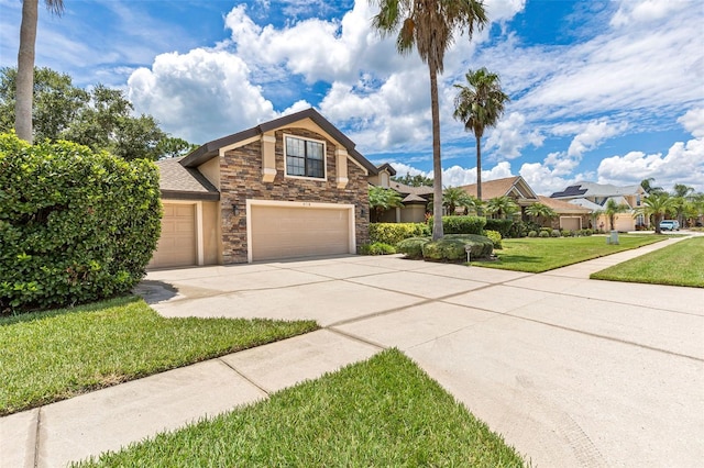 6710 Merryvale Ln, Port Orange, FL 32128 - craftsman house with stone siding, driveway, a front yard, and a residential view