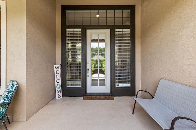 6710 Merryvale Ln, Port Orange, FL 32128 - doorway to property featuring stucco siding