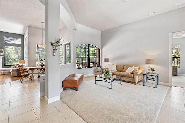 6710 Merryvale Ln, Port Orange, FL 32128 - living room with light tile patterned floors and vaulted ceiling