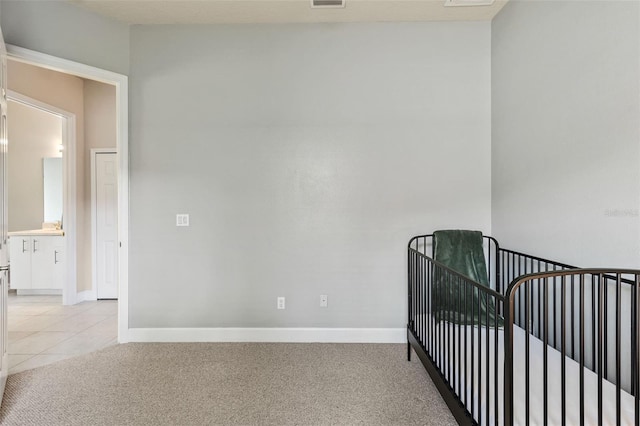 6710 Merryvale Ln, Port Orange, FL 32128 - bedroom with light carpet and light tile patterned flooring