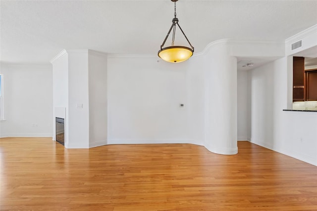 2515 S Atlantic Ave Unit 507, Daytona Beach, FL 32118 - spare room with light wood-style flooring and ornamental molding
