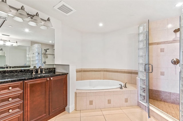 2515 S Atlantic Ave Unit 507, Daytona Beach, FL 32118 - full bathroom featuring a shower stall, vanity, tile patterned flooring, a garden tub, and recessed lighting
