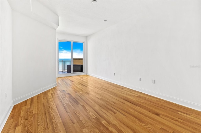 2515 S Atlantic Ave Unit 507, Daytona Beach, FL 32118 - unfurnished room featuring light wood-type flooring and baseboards