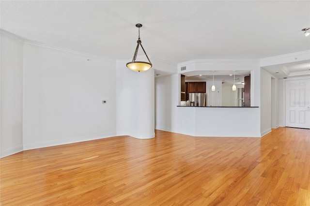 2515 S Atlantic Ave Unit 507, Daytona Beach, FL 32118 - unfurnished living room featuring light wood-type flooring and crown molding