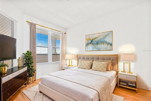 2515 S Atlantic Ave Unit 507, Daytona Beach, FL 32118 - bedroom featuring light wood-style flooring and multiple windows