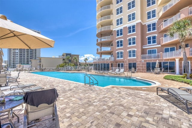 2515 S Atlantic Ave Unit 507, Daytona Beach, FL 32118 - community pool featuring a patio