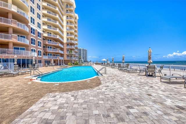 2515 S Atlantic Ave Unit 507, Daytona Beach, FL 32118 - community pool with a patio area and a water view
