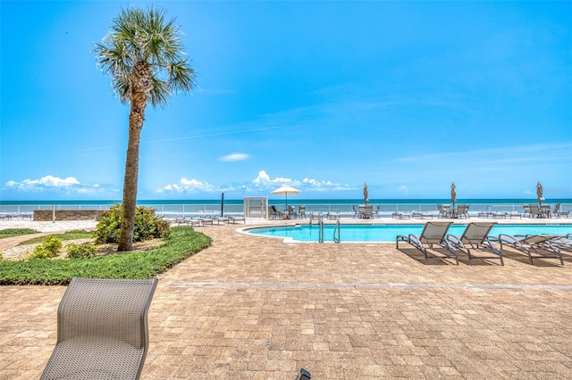 2515 S Atlantic Ave Unit 507, Daytona Beach, FL 32118 - community pool featuring a patio area and a water view