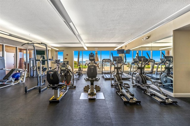 2515 S Atlantic Ave Unit 507, Daytona Beach, FL 32118 - exercise room with a textured ceiling and beam ceiling