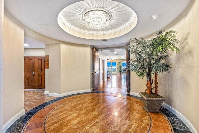 2515 S Atlantic Ave Unit 507, Daytona Beach, FL 32118 - hallway with inlaid floor details, a chandelier, recessed lighting, and a tray ceiling