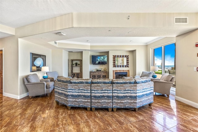 2515 S Atlantic Ave Unit 507, Daytona Beach, FL 32118 - living room featuring a fireplace and a textured ceiling