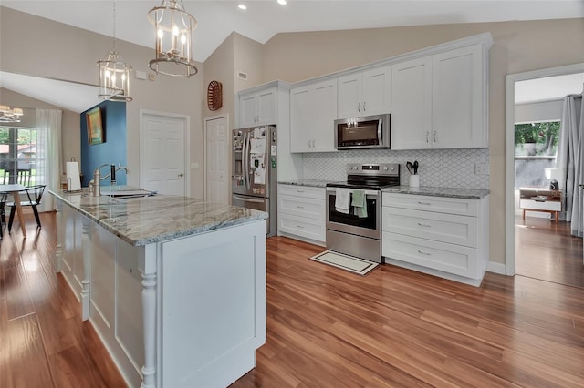 1522 E Silver Hammock, Deland, FL 32720 - kitchen with stainless steel appliances, a chandelier, white cabinetry, backsplash, and plenty of natural light