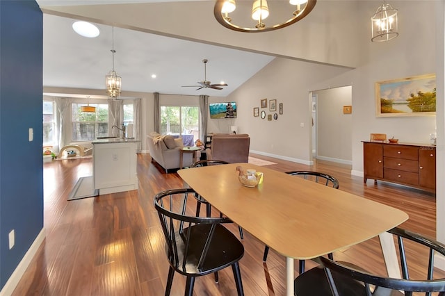 1522 E Silver Hammock, Deland, FL 32720 - dining space with dark wood-style flooring, a chandelier, a ceiling fan, and vaulted ceiling