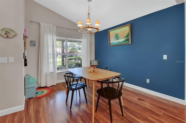 1522 E Silver Hammock, Deland, FL 32720 - dining room with a chandelier, wood finished floors, and lofted ceiling