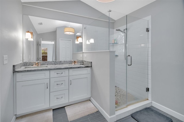 1522 E Silver Hammock, Deland, FL 32720 - bathroom featuring lofted ceiling, a shower stall, and double vanity