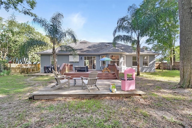 1522 E Silver Hammock, Deland, FL 32720 - rear view of property with a fenced backyard, a deck, and stucco siding
